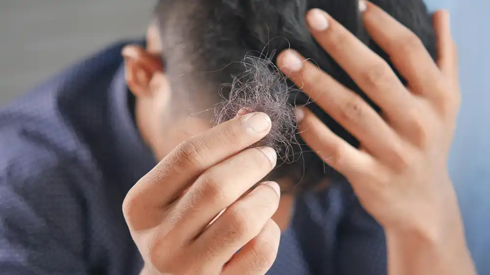 how to stop hair loss and regrow hair naturally